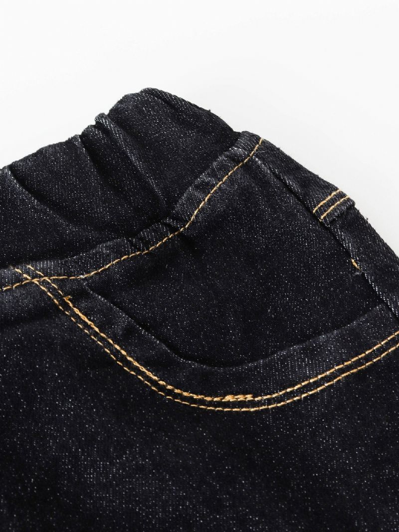 Flickor I Enfärgade Jeans